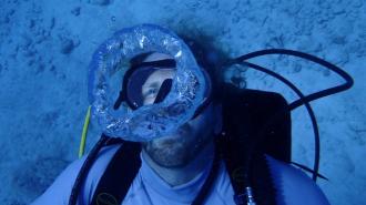 a man in scuba gear underwater