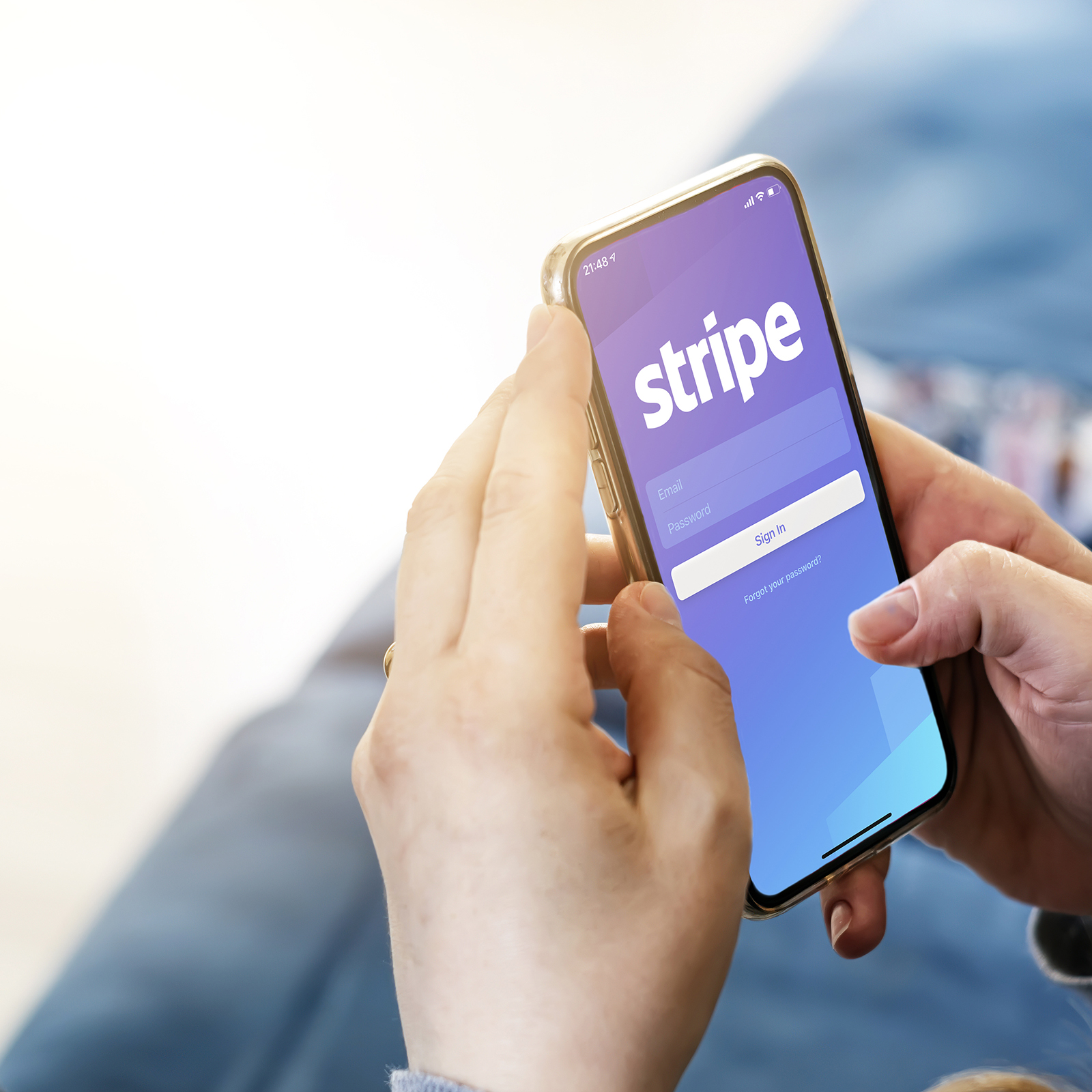 a phone displaying Stripe's logo