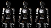 an image of three humanoid general purpose robots from the thighs up
