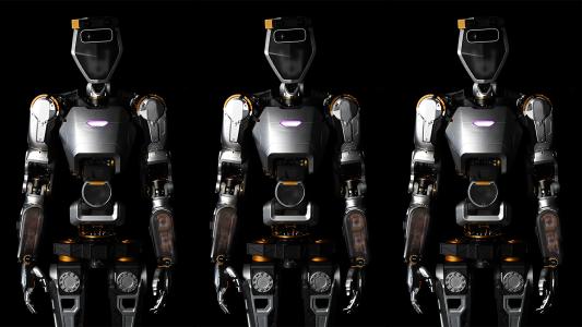an image of three humanoid general purpose robots from the thighs up