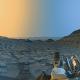 mars' surface with the left side of the image toned yellow and the right side blue